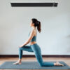 Home hot yoga studio with black infrared heater and smart in line thermostat